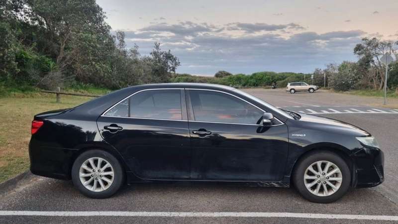Black Toyota Camry Hybrid available for weekly rental from Plenum in Newcastle